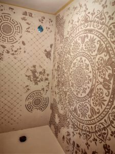 Modern bathroom renovation using stencil art and microcement finish
